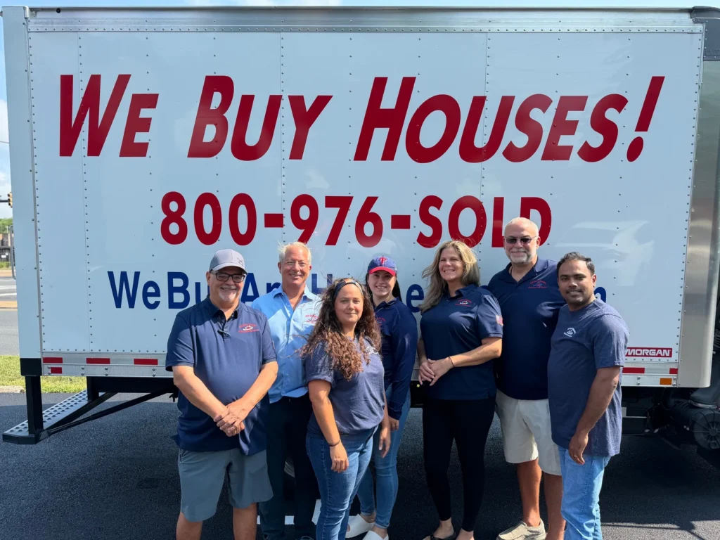 We Buy Any House Fast team with company truck in Levittown